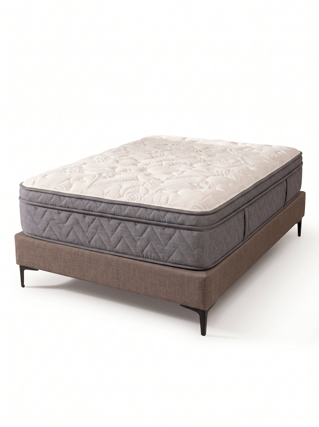 A mattress on a low upholstered bed frame with dark legs, photographed on a clean white studio background. The mattress has a quilted off-white top and a gray quilted side, while the bed base is taupe-brown.